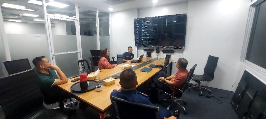 DBIRRP SIMEX team briefing in a meeting room