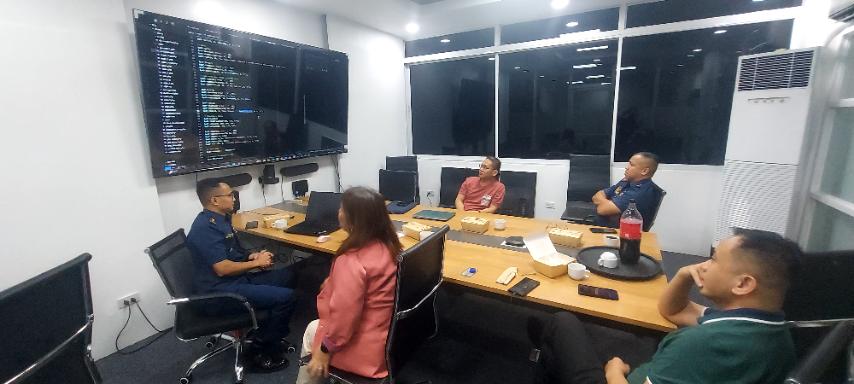 Team seated at a table during a simulation exercise
